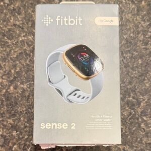Fitbit Sense 2 Soft Gold Aluminum case with blue mist infinity band